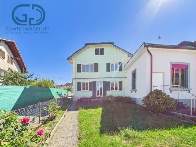 Maison contiguÃ« de 5.5 piÃ¨ces avec jardin, garage et beau potentiel
